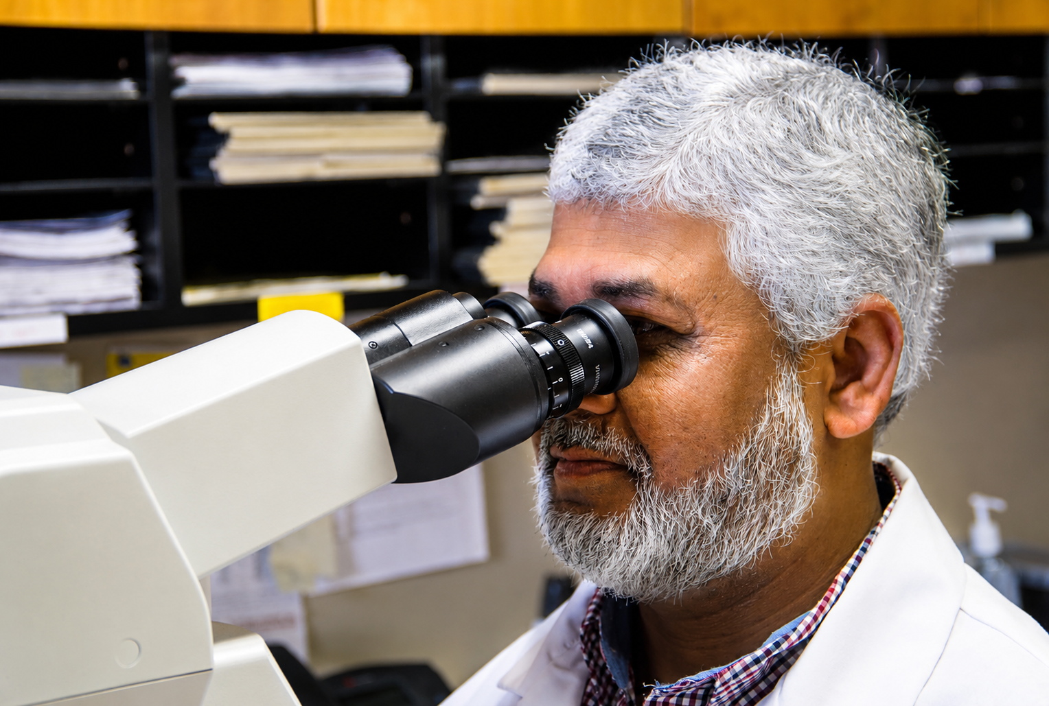 Benchmark Diagnostics laboratory professional reviewing pathology specimens